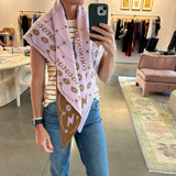 Pink and tan knit triangle scarf with celestial star and moon pattern