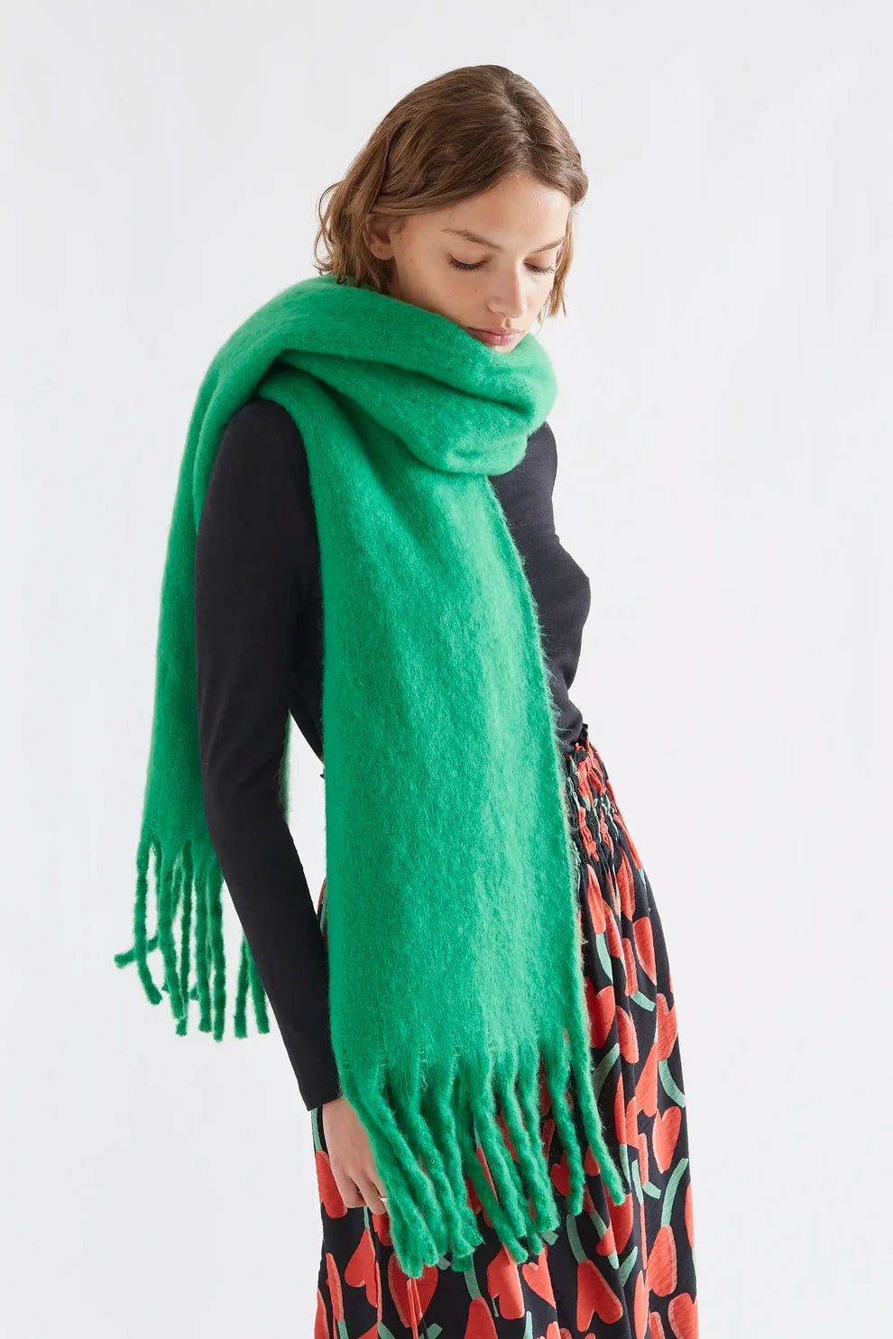 Fantastica bright green fringed oversized wool scarf styled around neck