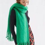 Fantastica bright green fringed oversized wool scarf styled around neck