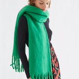 Fantastica bright green fringed oversized wool scarf styled around neck