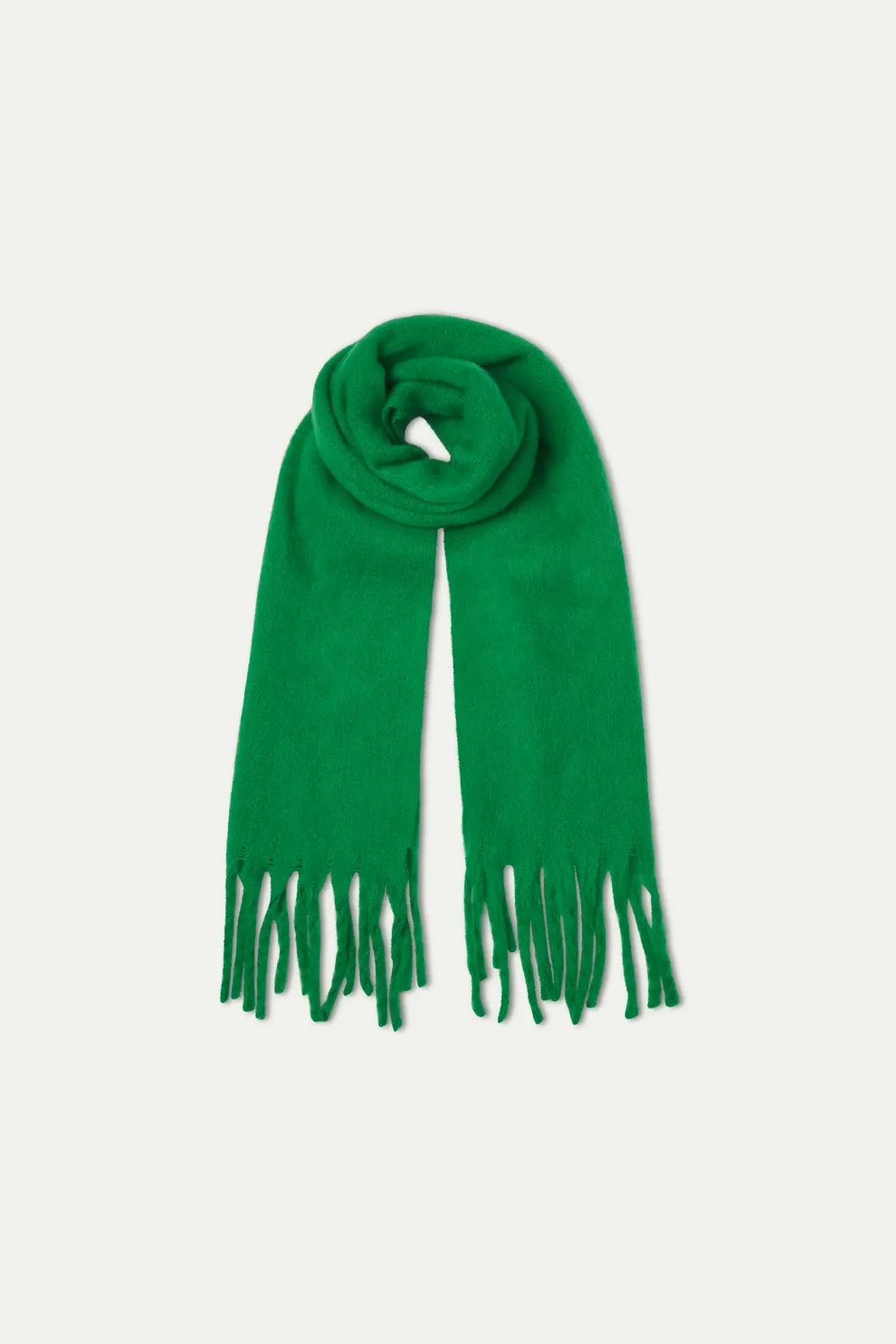 Bright green fringed scarf rolled at center, long tassel ends, soft knit fabric