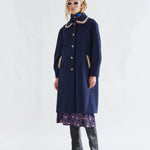 Navy blue wool coat with crochet collar and pocket trim, gold buttons, midi length
