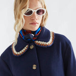 Fantastica navy blue coat with crochet-trimmed collar and gold buttons
