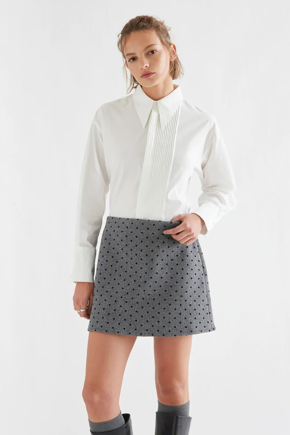 White cotton button-front shirt with pleated bib detail and long sleeves