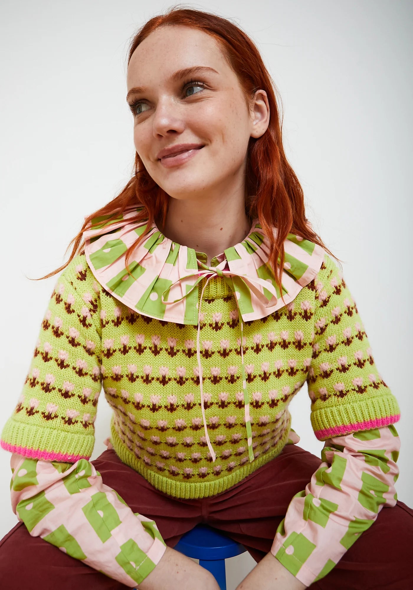 Lime green fair isle knit sweater with pink and brown floral pattern details