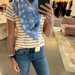 Freya Nebula Triangle Scarf in blue paisley print worn around neck