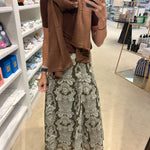 Fitted brown short-sleeve modal t-shirt styled with scarf and patterned maxi skirt