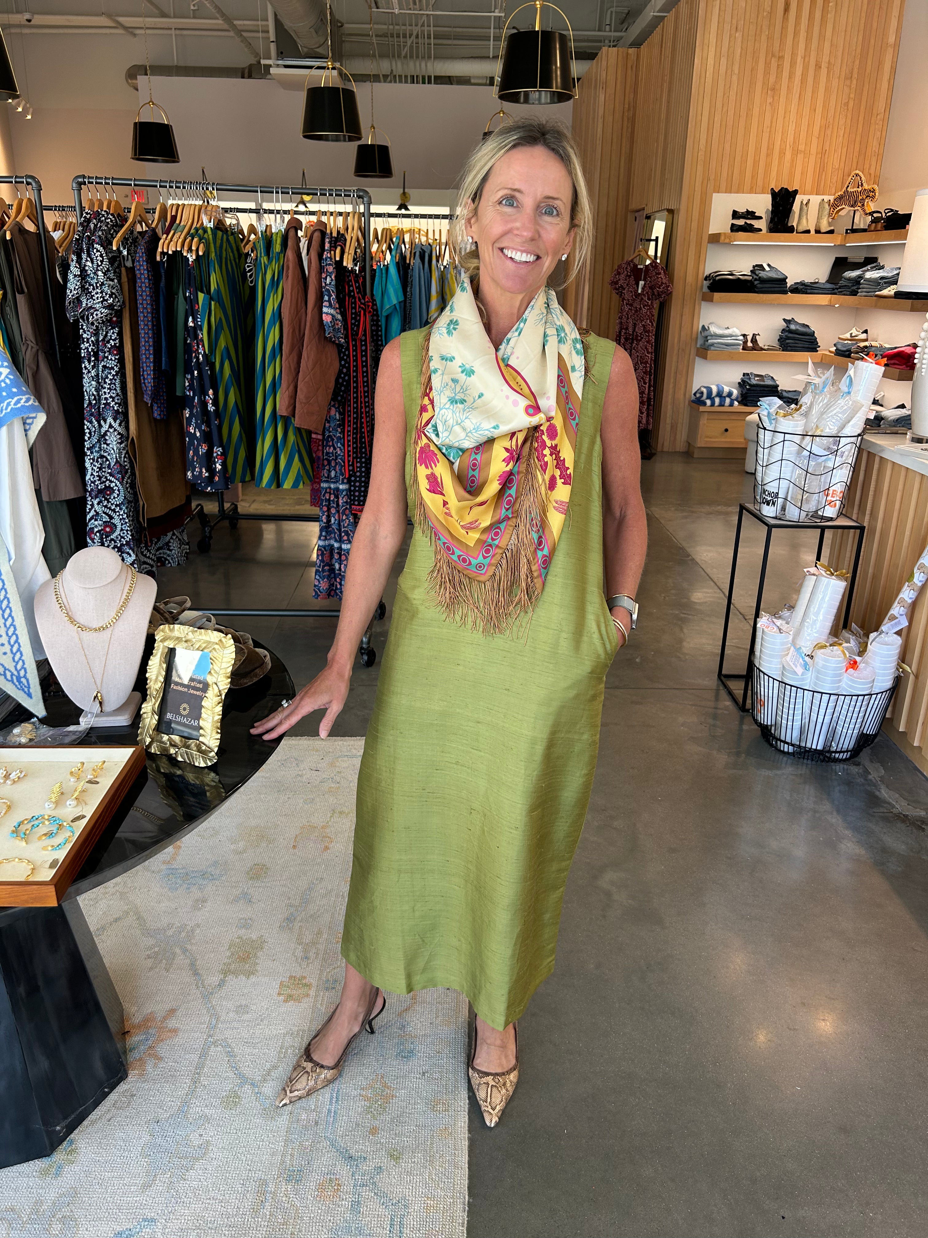 Livro Column Dress in olive green, sleeveless, midi length, styled with floral scarf