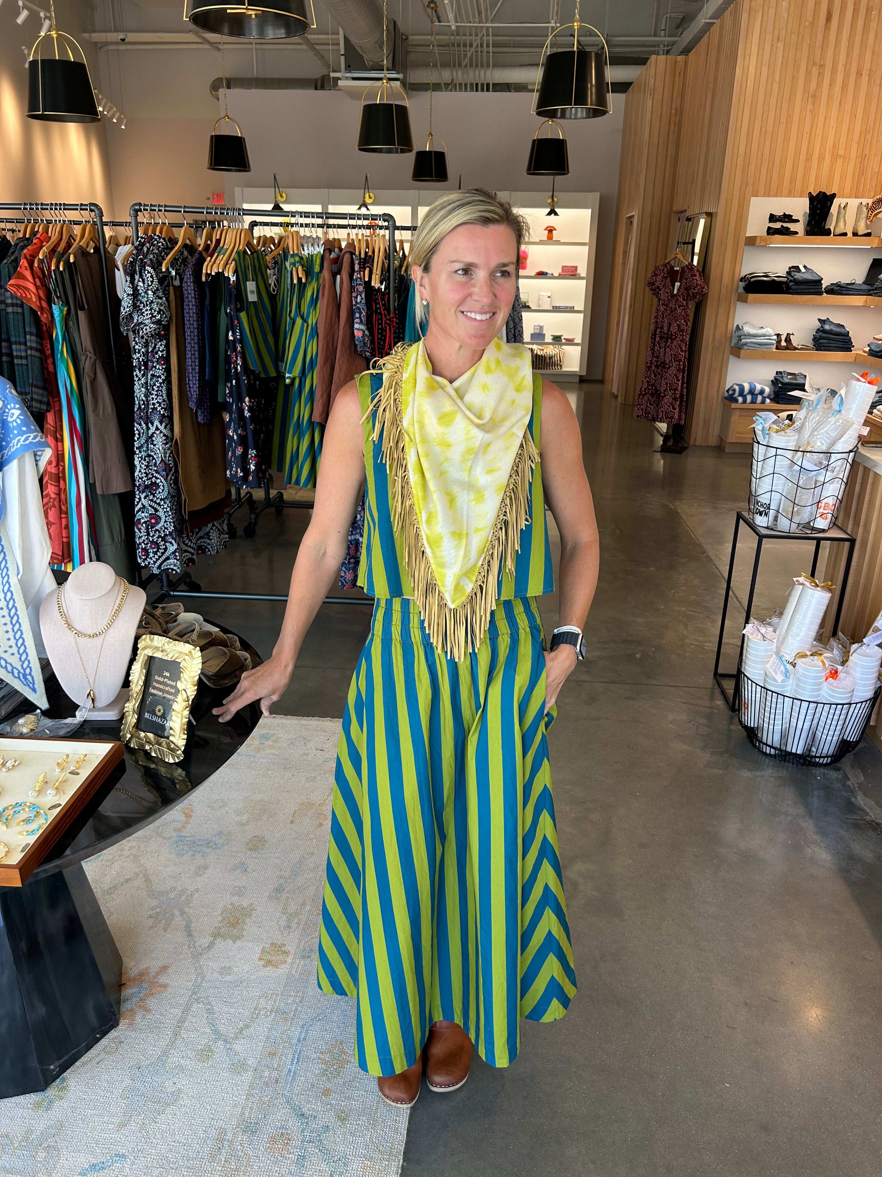 Sleeveless citron and teal stripe crop top with elastic waist, worn as dress