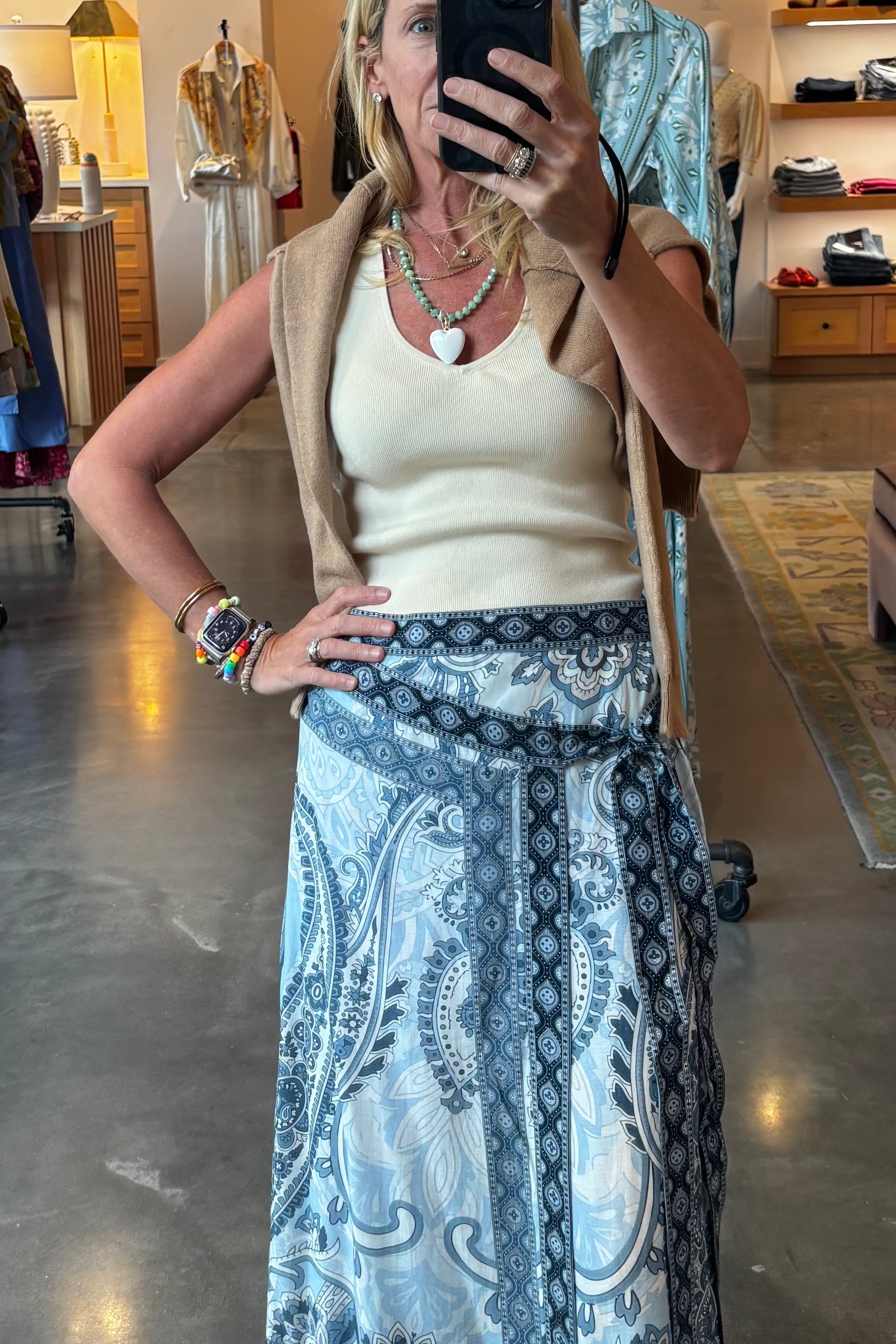 Blue and navy paisley print wrap midi skirt with asymmetrical front and flowing silhouette