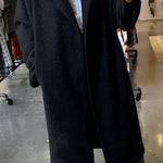 Black oversized bouclé longline coat with draped lapels, open front