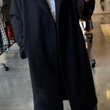 Black oversized bouclé longline coat with draped lapels, open front