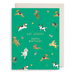 Green birthday card with playful illustrated dogs and "Let Loose! Happy Birthday" text