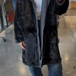 Black faux fur reversible hooded coat with grey lining, midi length