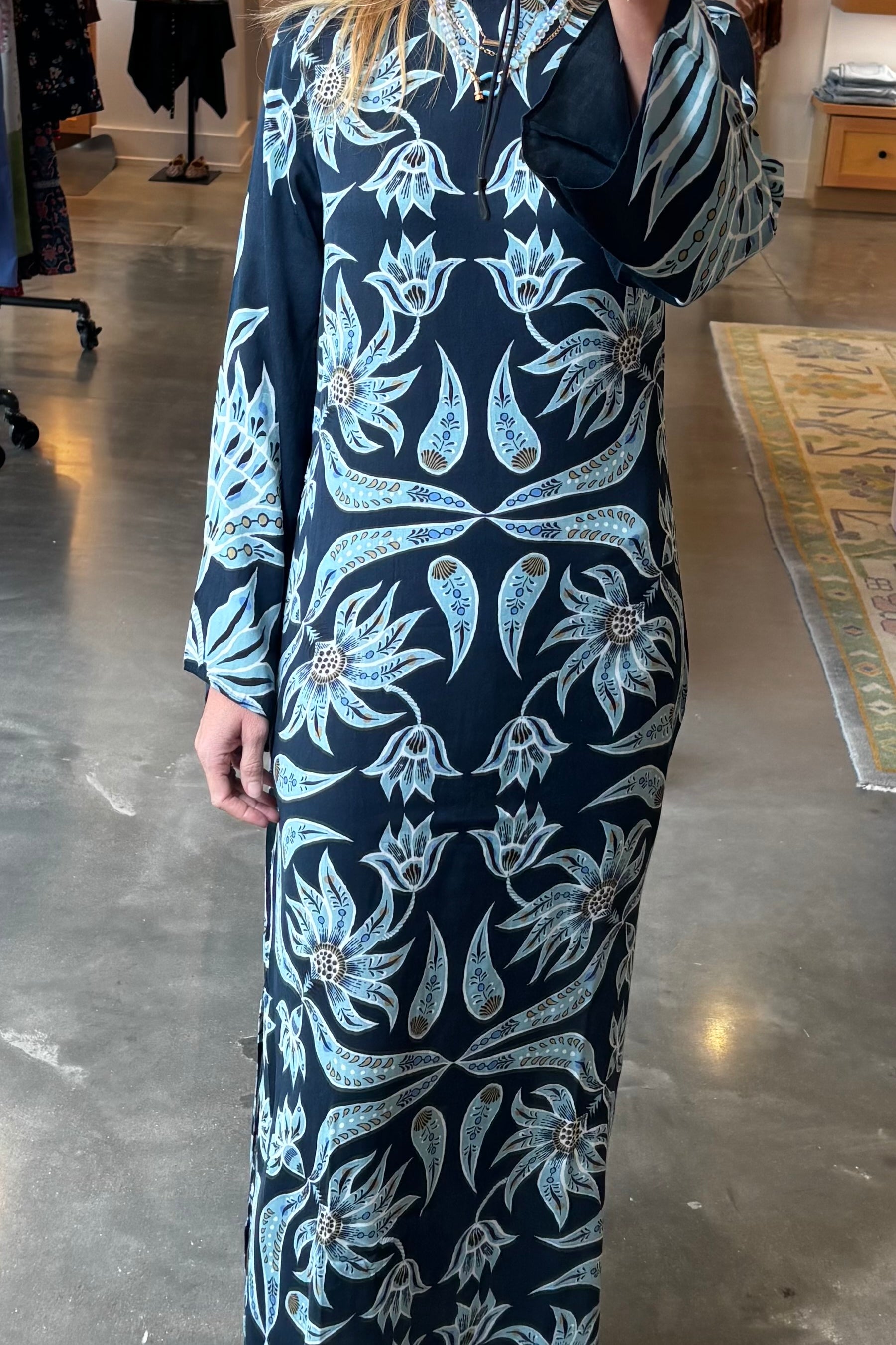 Navy maxi caftan dress with light blue floral print and long sleeves