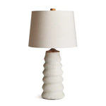 Cream textured ridged composite lamp base with tapered linen shade and wood finial