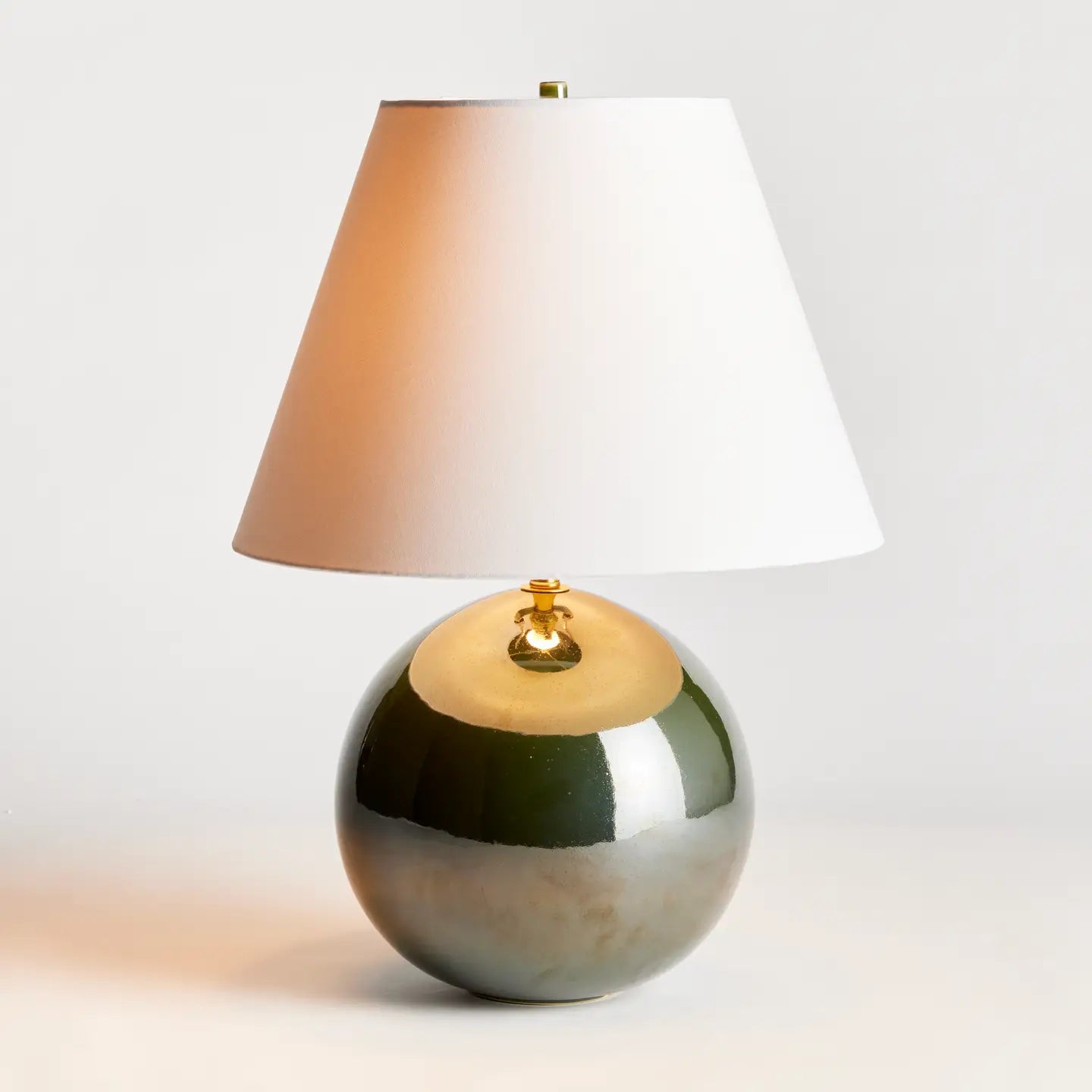 Napa Home Bellamy Lamp with glossy green ceramic globe base and white shade
