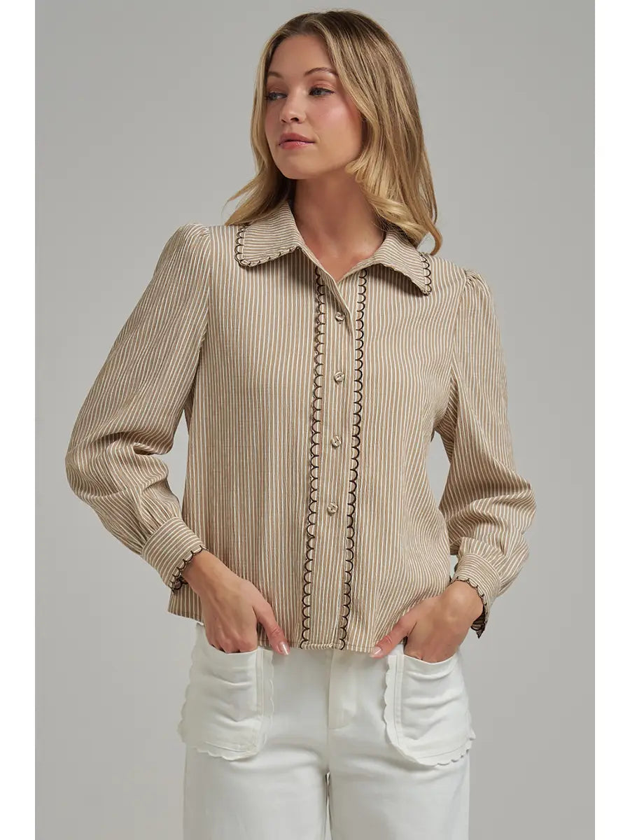Tan pinstripe button-down blouse with scallop edge stitching and long sleeves