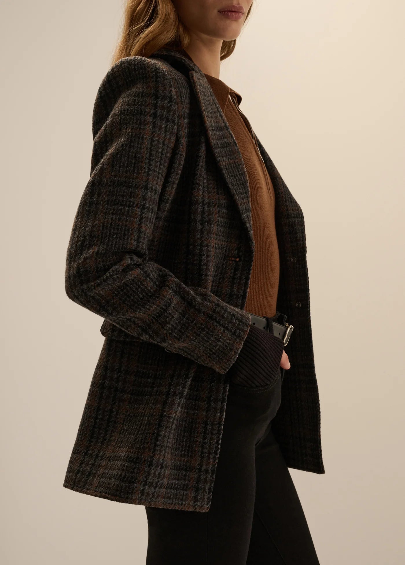 Navy plaid wool blazer with patch pockets, worn open over brown knit top