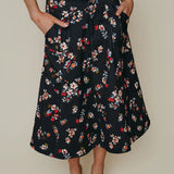 Midnight floral print midi A-line skirt with pockets and gold button detail