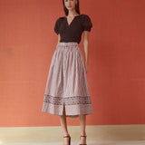 Brown and white striped midi skirt with embroidered hem border and button front