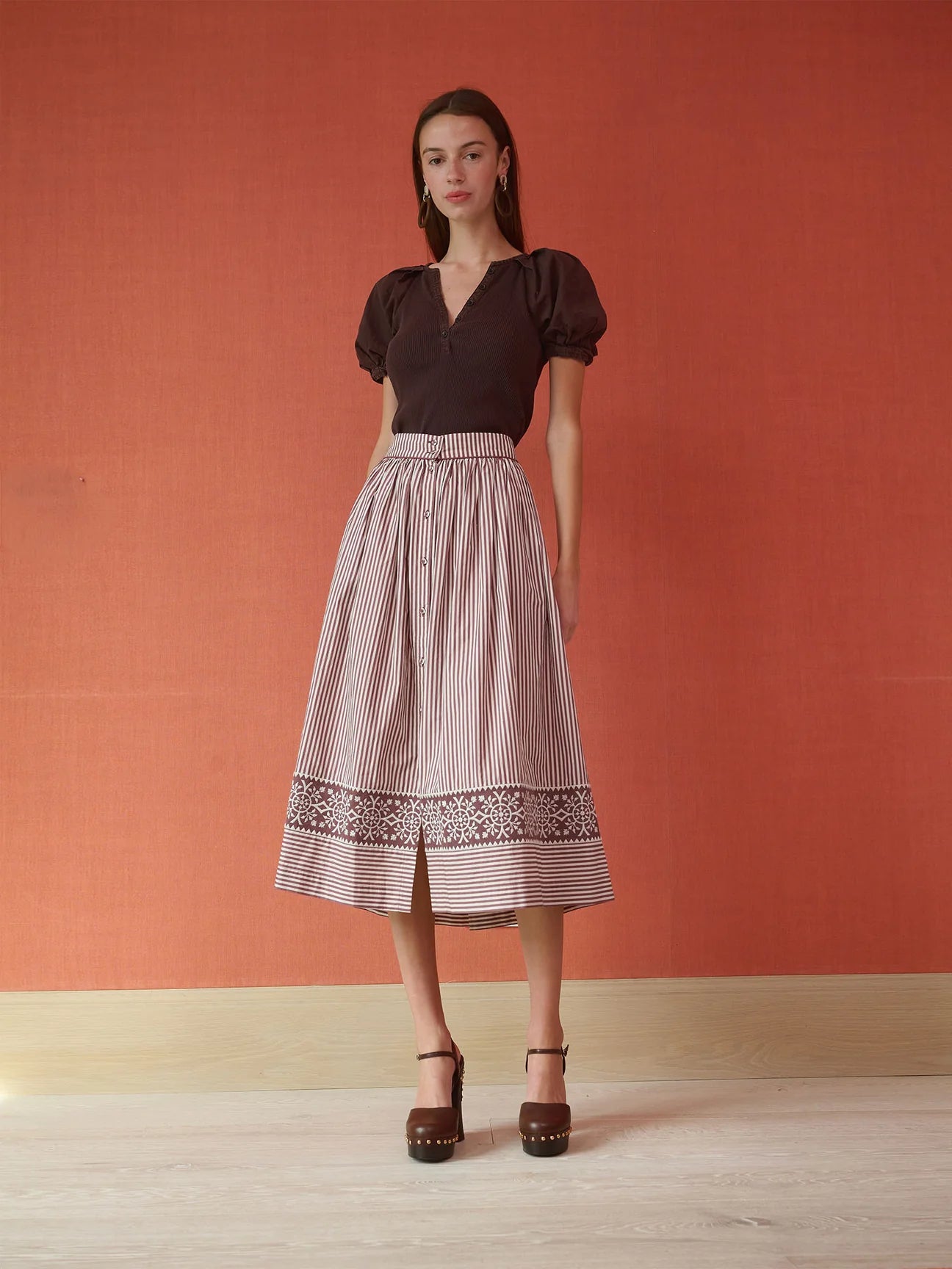 Brown and white striped midi skirt with embroidered hem border and button front