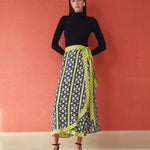 Midi wrap skirt in black floral print with lime green geometric border and tie waist