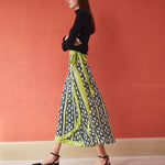 Midi wrap skirt in black and lime green floral print with tie waist