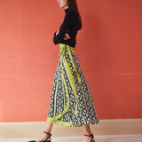 Midi wrap skirt in black and lime green floral print with tie waist