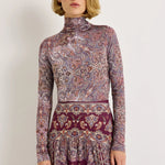 Fitted paisley print turtleneck top in purple and burgundy tones, long sleeves