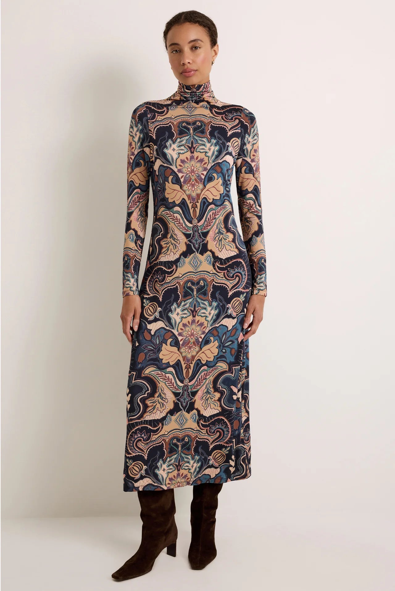 Long-sleeve midi turtleneck dress in navy and tan paisley print with slight A-line hem