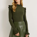 Dark green ribbed turtleneck sweater with ruffle shoulders and flared cuffs
