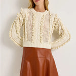 Ivory wool-blend crop sweater with open knit and ruffle trim accents, long sleeves