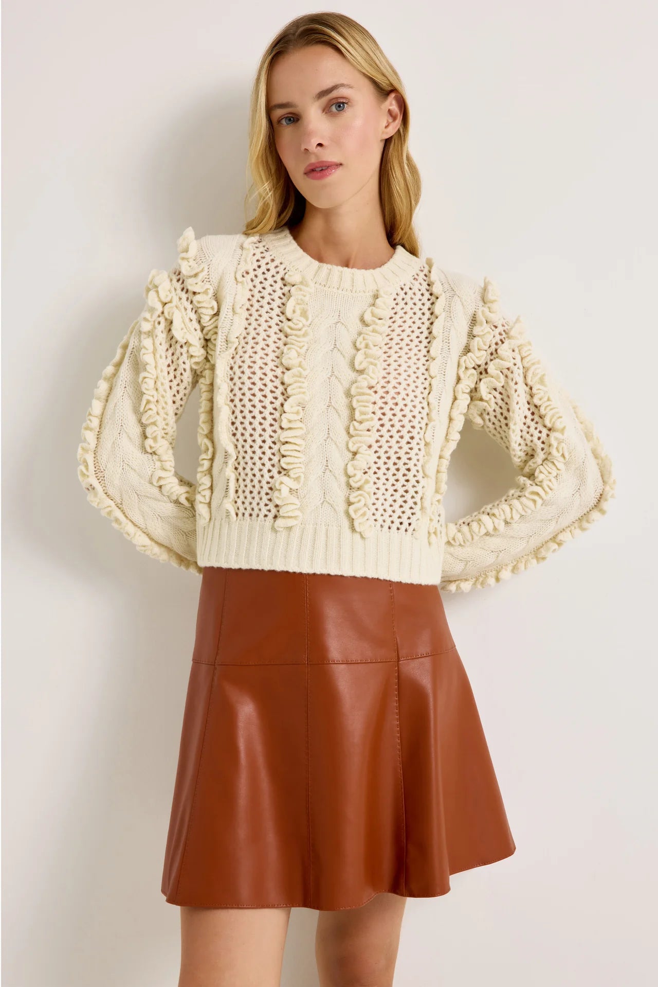 Ivory wool-blend crop sweater with open knit and ruffle trim accents, long sleeves