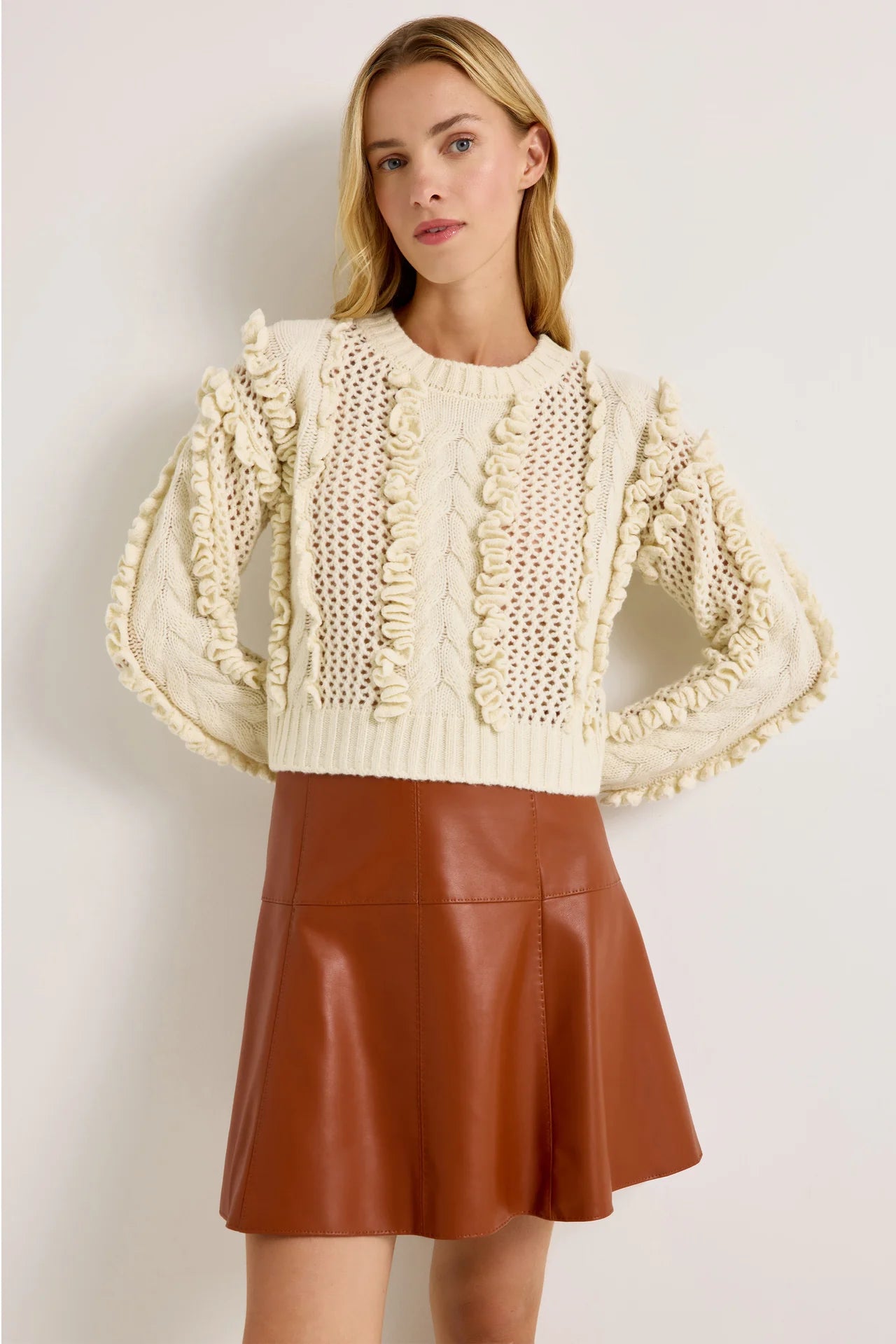 Ivory wool-blend crop sweater with open knit and ruffle trim accents, long sleeves