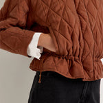 Marie Oliver Haisley quilted jacket in rust brown with drawstring waist