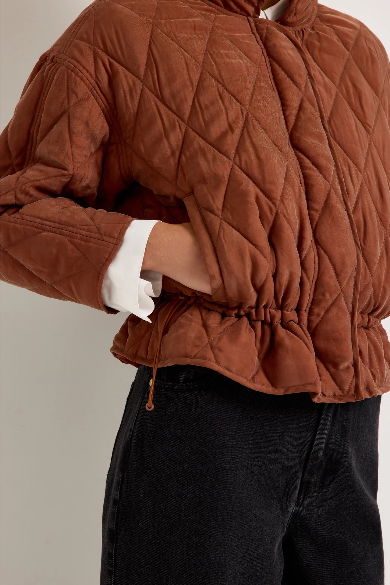Marie Oliver Haisley quilted jacket in rust brown with drawstring waist