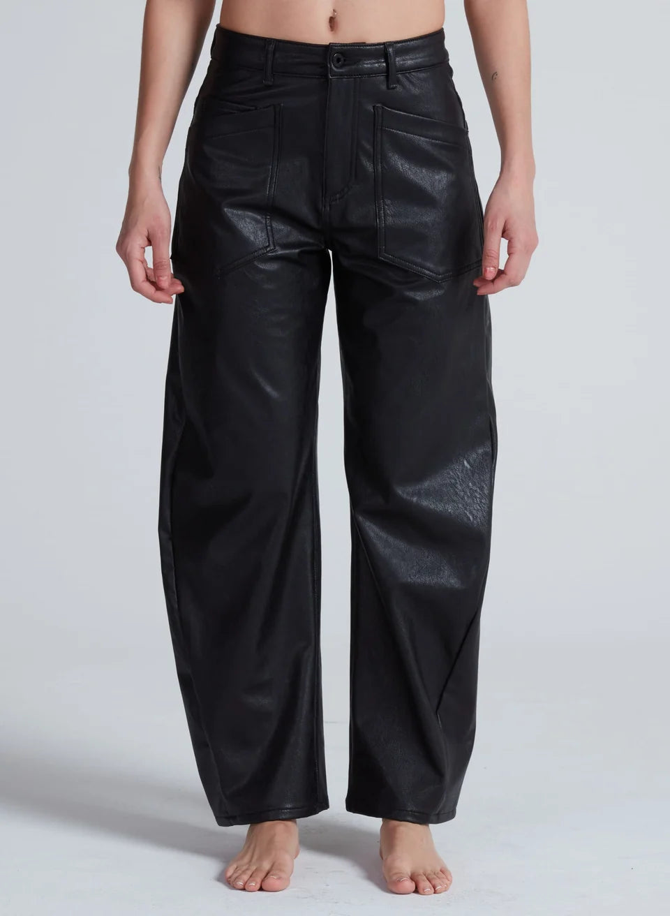 Black vegan leather wide-leg barrel trousers with high rise and patch pockets