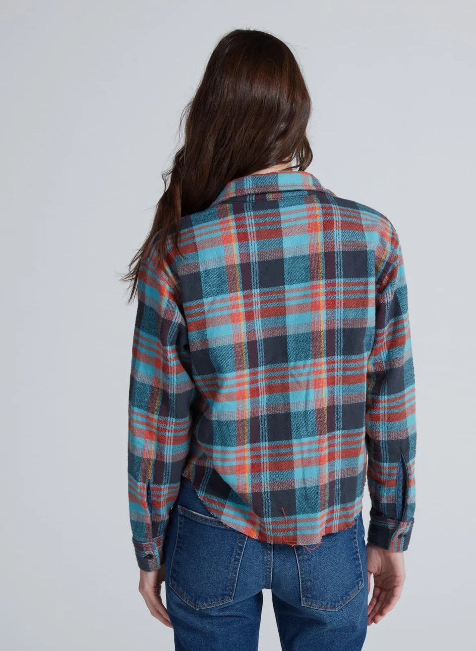 Cropped plaid flannel shirt in teal, navy, and orange shown from the back