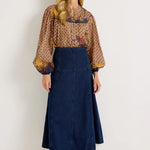 Dark wash denim A-line midi skirt with fitted waist and panel seam detailing