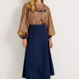 Dark wash denim A-line midi skirt with fitted waist and panel seam detailing