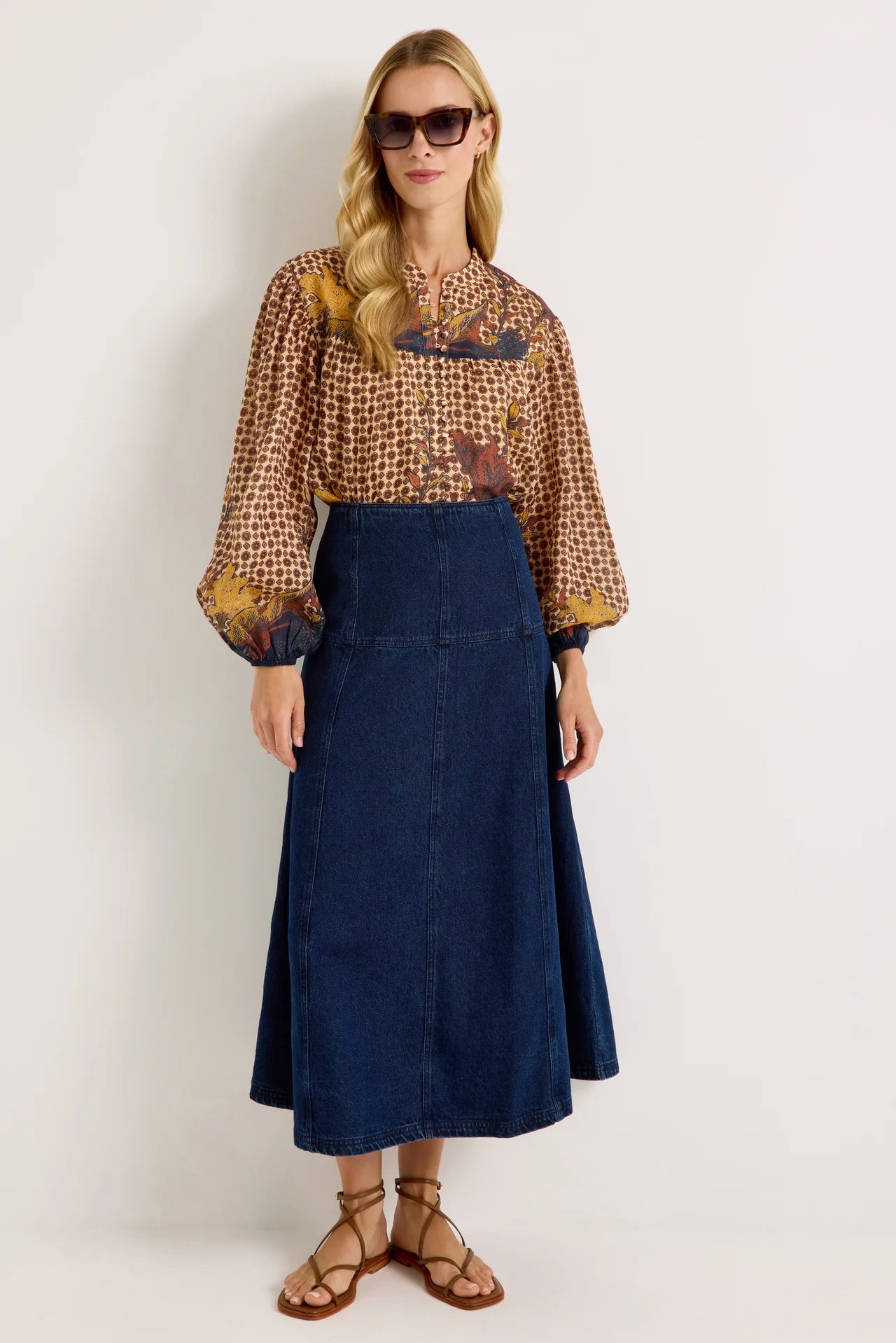 Dark wash denim A-line midi skirt with fitted waist and panel seam detailing