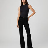 Black high-rise flare jeans with black sleeveless mock-neck bodysuit and leopard heels