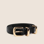 Skinny black leather belt coiled with polished gold buckle and keeper loop