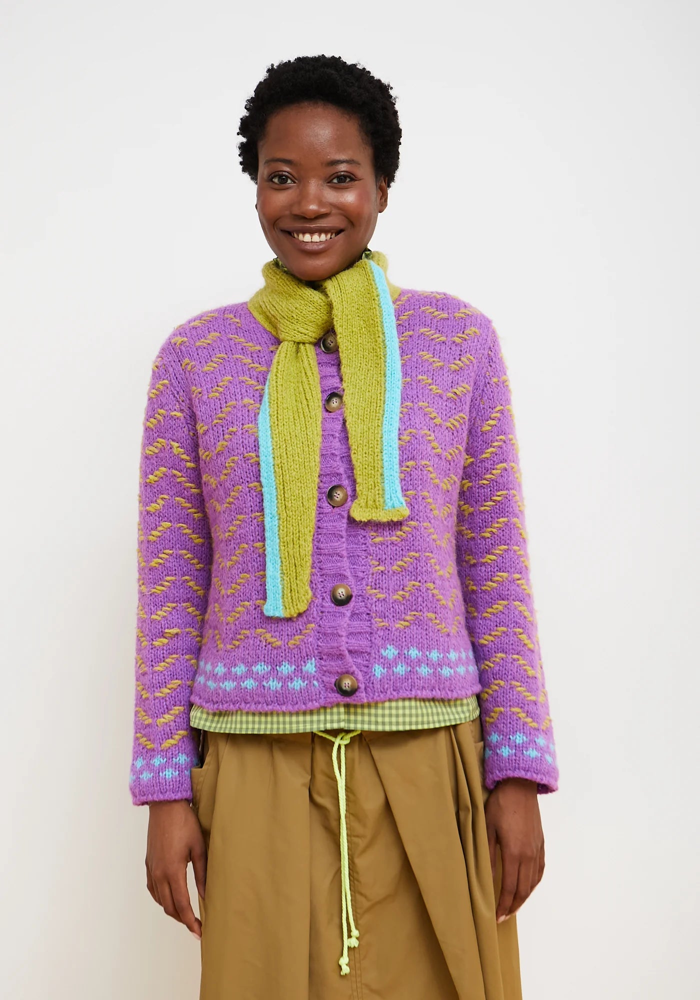 Dr Bloom Darling Sweater in purple with gold chevron pattern and brown buttons