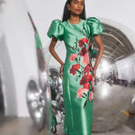 Green satin midi pencil dress with red floral embroidery and puff sleeves