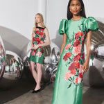Hunter Bell Vesper green floral midi dress with puff sleeves on model
