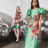 Hunter Bell Vesper green floral midi dress with puff sleeves on model