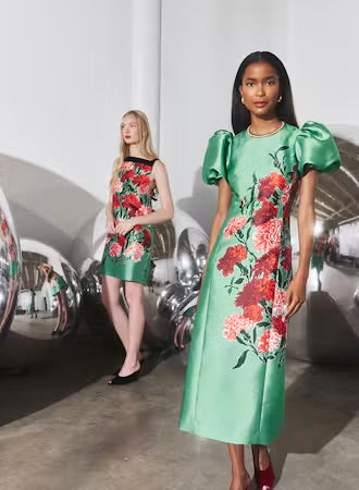 Hunter Bell Vesper green floral midi dress with puff sleeves on model