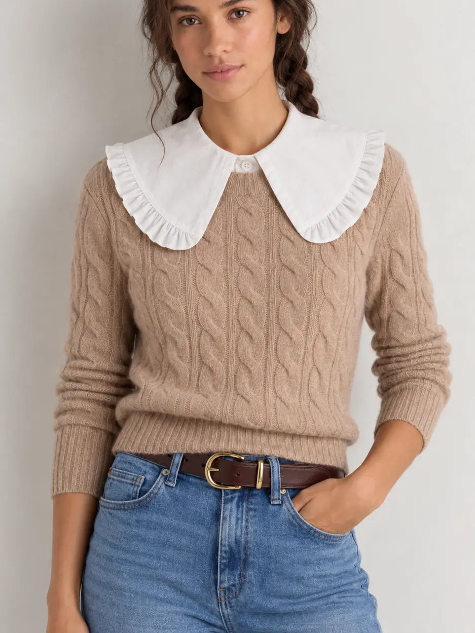 White oversized ruffle Peter Pan collar dickey layered over beige cable-knit sweater